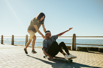 Boys enjoying outdoors on seaside road © Jacob Lund