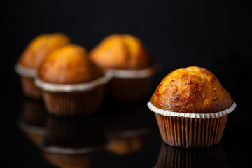 Tasty muffin closeup on a dark backgrownd