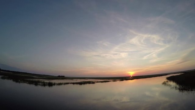 sunset on hunting island wetlands in south carolina