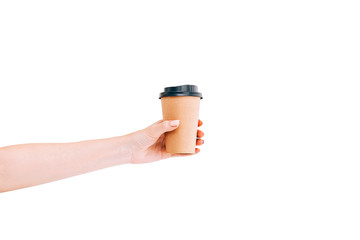 Paper coffee cup to go in woman's hand isolated on white. Mockup.