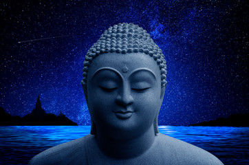 Buddha head with star background