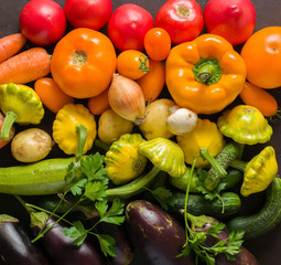 Summer vegetables of different colors. The alternation of colors in a rainbow. For salad or for a vegetable dish.