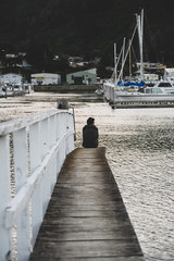 view of pier with man on the end