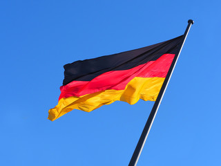 Flag of Germany against the blue sky