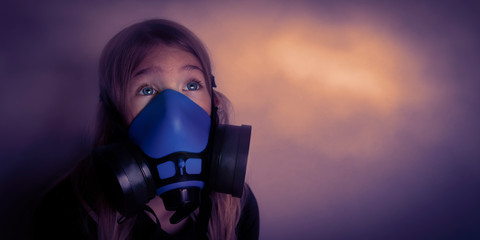 Young girl wearing gasmask, respirator portrait. Effects of worldwide air pollution, industrial...