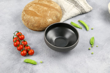 composition with tomato, bread, plate and green pea