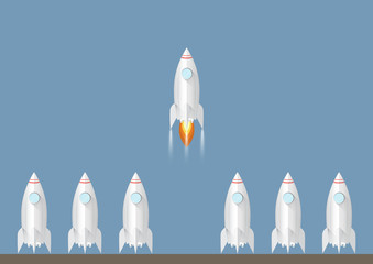 One rocket launching amongst the others. Start up and  leadership business concept vector illustration