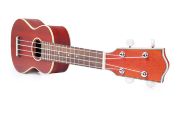 Fototapeta premium Ukulele Mahogany on a white background, Brown ukulele made from mahogany.