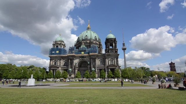 Berlin Cathedral with green dome seen from Lustgarten with visitors and tourists in a front. Berlin Dome on   Museum Island is largest church and one of the major sights in Berlin. Landmarks. Baroque 