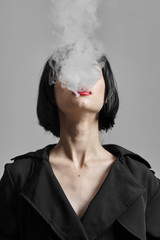 woman smoking a cigarette smoke