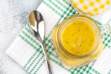 Smoothie with tropical fruits: mango, banana, avocado, chia seeds in a glass jar
