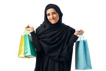 islam woman with colored shopping packages