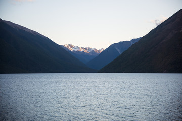 Lake with mountains and sunset