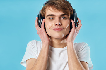 man in headphones on a blue background