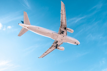 Aviation, travel, air transportation concept. Airplane in blue sky