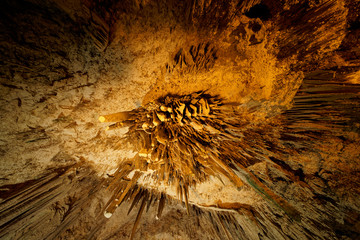 A set of stalactites from below at the imposing limestone cave (Tropfsteinhöhle) Grotta di Nettuno in Sardegna (Italy) © Adrian