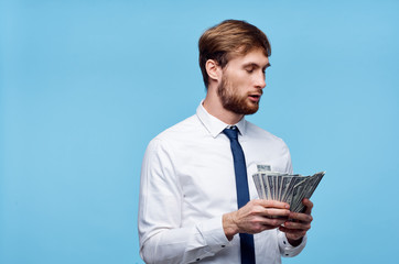business man with money on a blue background