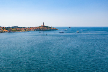 Aerial view of costal town. Aerial seaside buildings view. Aerial photo of the seashore buildings with green trees and small islands.