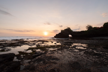 Obraz premium Indonesia famous place attraction for tourist Pura Batu Bolong small shrine located on west side from the famous Tanah Lot temple,Bali Indonesia
