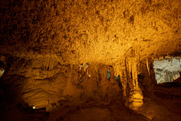 Hundrets of small stalactites hanging down inside the Imposing limestone cave (Tropfsteinhöhle) Grotta di Nettuno in Sardegna (Italy) © Adrian