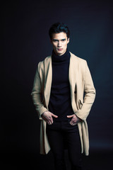 handsome asian fashion looking man posing in studio on black background, lifestyle modern people...