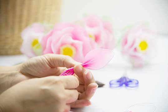 Woman making beautiful nylon flower - people with DIY handmade flower concept