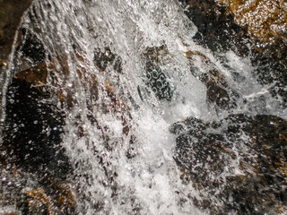 waterfall closeup with spray and rocks