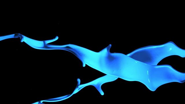 Super slow motion of splashing blue paint isolated on black background. Filmed on very high speed camera, 1000 fps.