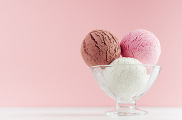 Ice cream scoops different flavor - strawberry, chocolate, creamy  in transparent glass ice-cream...