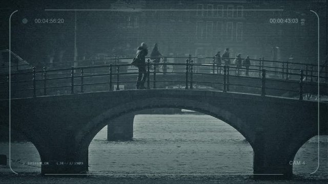 CCTV People Walk And Cycle Over Bridge