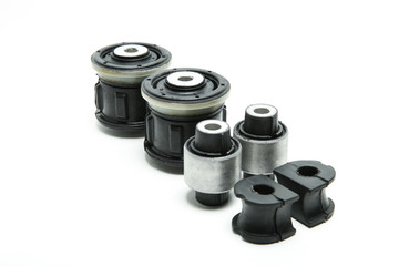 spare parts for the running system of the car. rubber silent blocks on white background with copy space