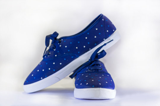 Blue Canvas Shoes On A White Background