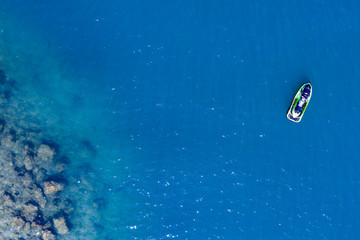 Fototapeta premium Aerial view of boats and ski jets in the sea. Boats and ski jets in the ocean. 