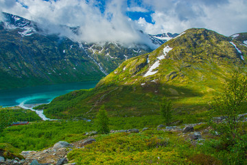 Memurubu base, the starting point of the most beautiful mountain trek in Norway through the Besseggen ridge to Gjendeshaim, Jotunheimen National Park, Norway - obrazy, fototapety, plakaty