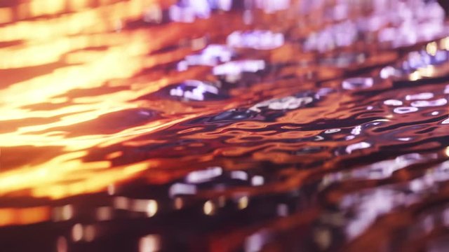 Slow motion ocean waves close up at sunset. Loop. 3D animation. 4k.