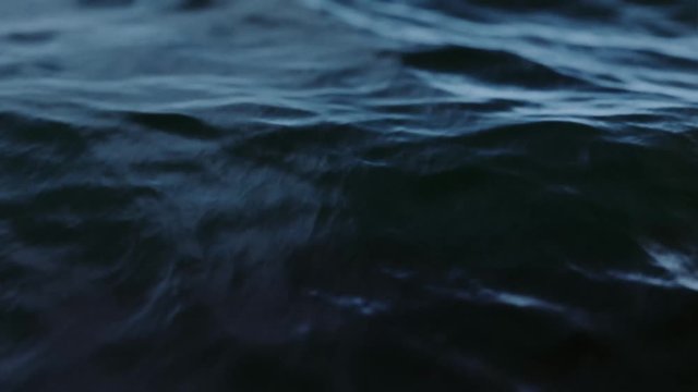 Dark slow motion ocean waves close up. Loop. 3D animation.