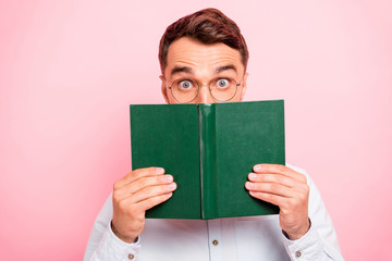 Close up photo portrait of comic cheerful enthusiastic with big staring looking eyes holding paper...