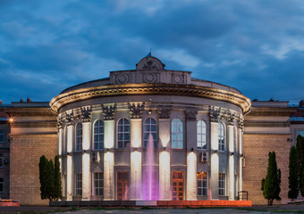 Beautiful semicircular building against evening sky