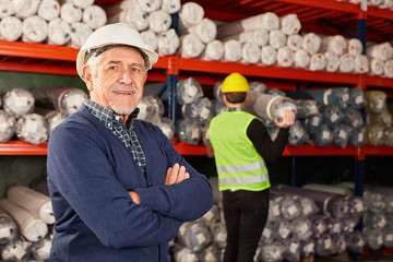 Senior as a confident warehouse worker