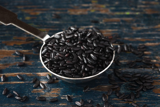 Black Heirloom Forbidden Rice Spilled from a Teaspoon