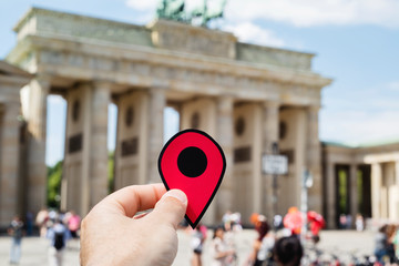 man with a red marker in the Brandenburg Gate