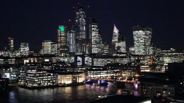 London Business district skyline skyscrapers of famous 'square mile' lit up at night 