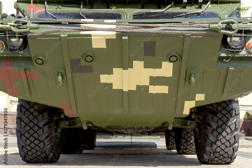 Wall mural Armored fighting combat vehicle. Close-up combat military equipment.