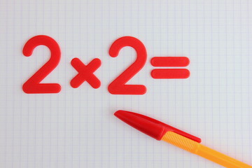A simple mathematical example in a clean school notebook. Back to school.