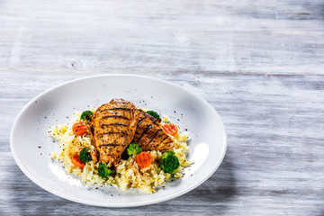 Grilled chicken fillets, rice and vegetables
