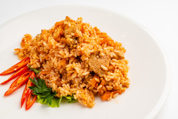 rice pilaf with meat, carrot and onion isolated on white background