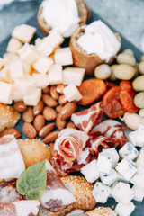 Bruschettes and a picnic with prosciutto. Italian theme in food, cheese and meat sliced.