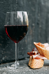 Bruschettes and a picnic with prosciutto. Italian theme in food, cheese and meat sliced.