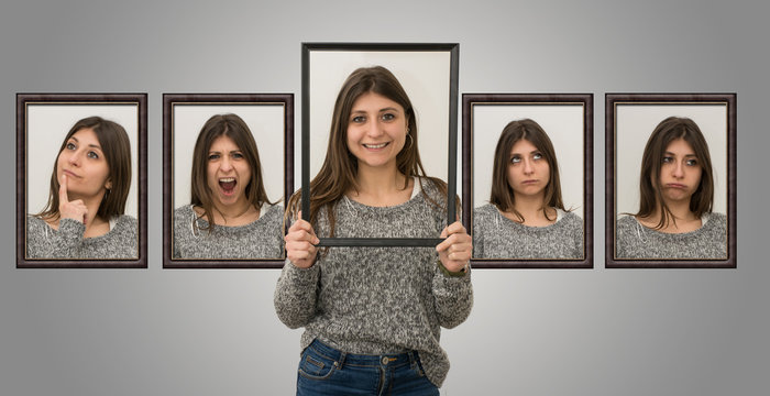 Pretty girl shows various facial expressions with a picture frame in her hands