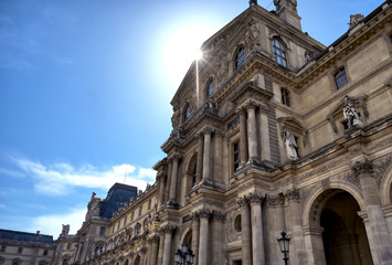 Fototapeta na wymiar Paris, France - April 21, 2019 - A view of the Louvre Museum, the world's largest art museum and a historic monument in Paris, France, on a sunny day.